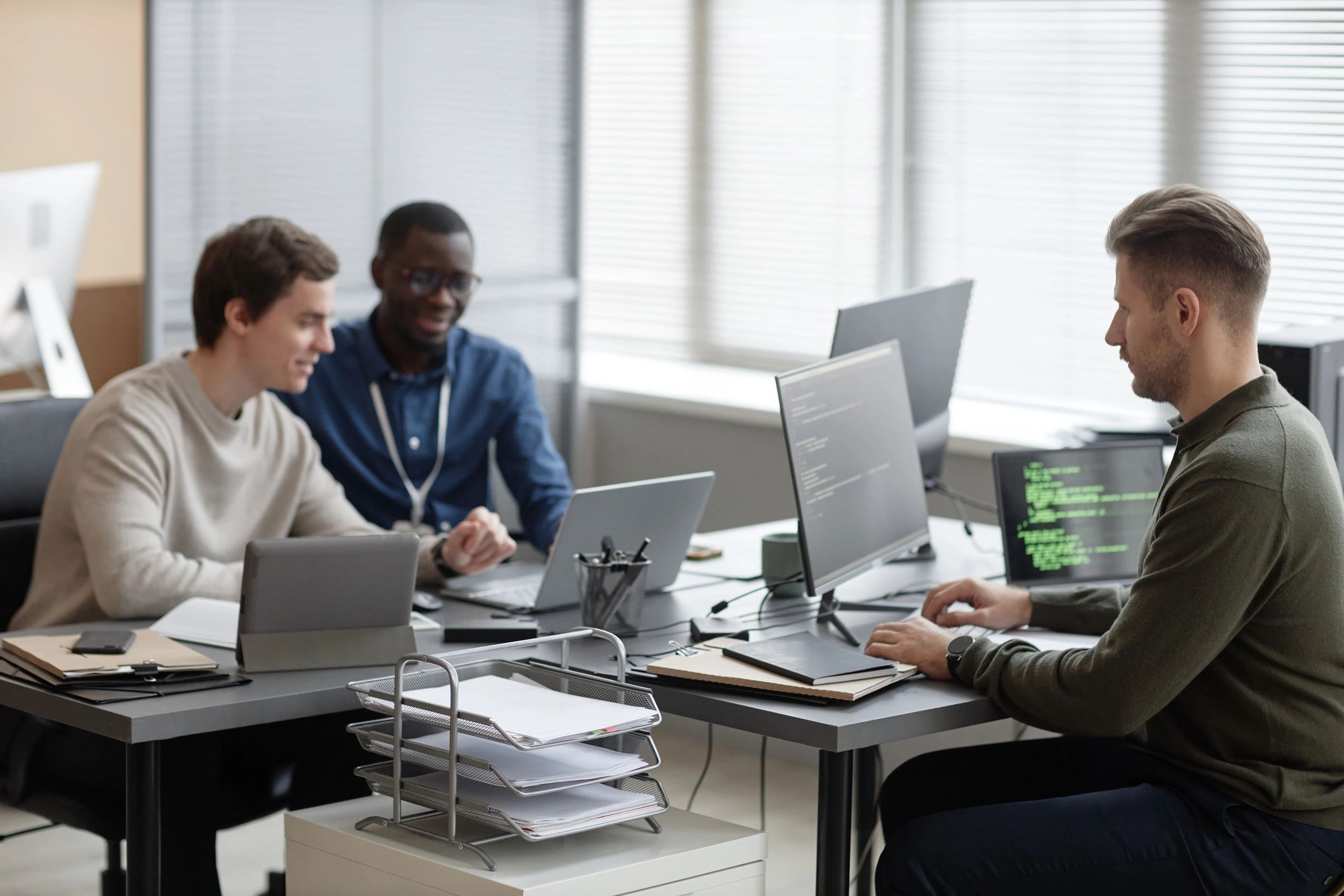 Modern team reviewing email campaign performance on screens